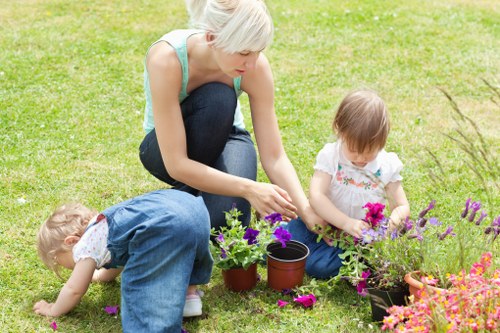 Insurance documentation and public liability certificate on a clipboard for an insured gardening company